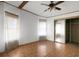 Bedroom with tile floor, mirrored closet, and window at 450 Tivoli Park Dr, Davenport, FL 33897