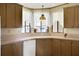 Kitchen featuring wood cabinets and a stained glass light fixture at 450 Tivoli Park Dr, Davenport, FL 33897