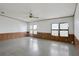 Bright living room featuring tile floors and wood paneling at 450 Tivoli Park Dr, Davenport, FL 33897