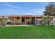 Covered patio area with access to the backyard at 450 Tivoli Park Dr, Davenport, FL 33897