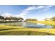 Scenic community lake with fountain and lush landscaping at 223 Lake Davenport Estates, Davenport, FL 33897