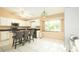 Kitchen with granite countertops, stainless steel appliances, and an island with seating at 223 Lake Davenport Estates, Davenport, FL 33897