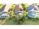 Three houses with pools and solar panels viewed from above at 223 Lake Davenport Estates, Davenport, FL 33897