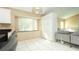 Kitchen features white cabinets, granite countertops, and a breakfast bar at 223 Lake Davenport Estates, Davenport, FL 33897