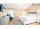 Main bedroom with king-size bed, dresser, and a sitting chair at 223 Lake Davenport Estates, Davenport, FL 33897