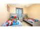 Bedroom with twin beds and superhero-themed decor at 223 Lake Davenport Estates, Davenport, FL 33897
