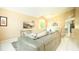 Spacious living room with comfortable seating and a large TV at 223 Lake Davenport Estates, Davenport, FL 33897