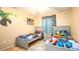 Bedroom with twin beds and superhero-themed decor at 223 Lake Davenport Estates, Davenport, FL 33897