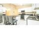 Kitchen with granite countertops, stainless steel appliances, and an island with seating at 223 Lake Davenport Estates, Davenport, FL 33897