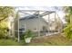 Screened-in pool in backyard with a small patio at 223 Lake Davenport Estates, Davenport, FL 33897