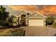 Attractive single-story house with a two-car garage and a paved driveway at 223 Lake Davenport Estates, Davenport, FL 33897