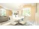 Modern dining room with a white table and chairs, near living room at 223 Lake Davenport Estates, Davenport, FL 33897