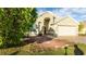 Two-story house with attached garage and landscaped yard at 223 Lake Davenport Estates, Davenport, FL 33897