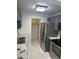 Modern kitchen with stainless steel appliances at 2727 W Oak Ridge Rd # 3, Orlando, FL 32809