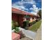 Condo building exterior with landscaping and palm trees at 2727 W Oak Ridge Rd # 3, Orlando, FL 32809