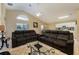 Open living room with comfortable seating and a view of the kitchen at 523 Balmoral Dr, Davenport, FL 33896
