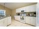 Well-equipped kitchen with white appliances and cabinetry at 523 Balmoral Dr, Davenport, FL 33896