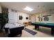 Game room with pool table and air hockey table at 523 Balmoral Dr, Davenport, FL 33896