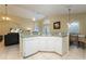 Kitchen with white cabinets, ample counter space, and island at 523 Balmoral Dr, Davenport, FL 33896