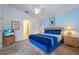 Main bedroom with king-size bed and en-suite bathroom at 523 Balmoral Dr, Davenport, FL 33896