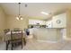 Bright kitchen with an island and dining area at 523 Balmoral Dr, Davenport, FL 33896