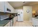 Modern kitchen featuring white appliances and cabinetry at 523 Balmoral Dr, Davenport, FL 33896