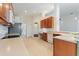 Kitchen boasts ample counter space, wood cabinets, and stainless steel appliances at 520 Vista Oaks Way, Davenport, FL 33837