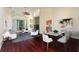 Open concept living and dining area with hardwood floors and modern furniture at 520 Vista Oaks Way, Davenport, FL 33837