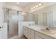 Double vanity bathroom with a shower and additional toilet at 520 Vista Oaks Way, Davenport, FL 33837