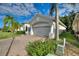 Single-story home with a two-car garage and landscaped yard at 520 Vista Oaks Way, Davenport, FL 33837