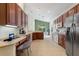 Spacious kitchen with wood cabinets, stainless steel appliances, and an island at 520 Vista Oaks Way, Davenport, FL 33837