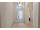 Bright entryway with tile flooring and a decorative glass front door at 520 Vista Oaks Way, Davenport, FL 33837