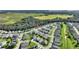 Aerial view showing home location in a neighborhood near a large body of water at 520 Vista Oaks Way, Davenport, FL 33837