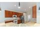 Well-equipped kitchen with ample cabinetry, stainless steel appliances, and a breakfast bar at 520 Vista Oaks Way, Davenport, FL 33837