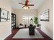Home office with built-in shelving, desk and comfortable seating at 520 Vista Oaks Way, Davenport, FL 33837