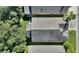 Top-down view of a house with a dark gray roof at 520 Vista Oaks Way, Davenport, FL 33837