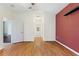 Spacious bedroom with wood flooring and access to a hallway bathroom at 520 Vista Oaks Way, Davenport, FL 33837