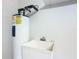 Laundry area with water heater and sink at 657 Vineyard Way, Kissimmee, FL 34759