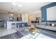 Open living room with gray sofa, glass coffee table, and access to a pool at 4845 Romeo Cir, Kissimmee, FL 34746