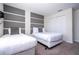 Bedroom with twin beds and gray headboard wall at 4845 Romeo Cir, Kissimmee, FL 34746