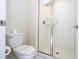 Clean bathroom with a walk-in shower and toilet at 4845 Romeo Cir, Kissimmee, FL 34746