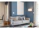Cozy living room featuring a comfortable sofa and stylish decor at 4845 Romeo Cir, Kissimmee, FL 34746