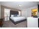 Spacious main bedroom with large bed and ensuite bathroom at 4845 Romeo Cir, Kissimmee, FL 34746