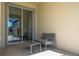 Small patio with seating area adjacent to the pool at 4845 Romeo Cir, Kissimmee, FL 34746