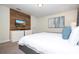 Main bedroom with a large bed, TV, and wood accent wall at 4845 Romeo Cir, Kissimmee, FL 34746