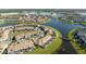 Aerial view of community with lake and townhomes at 4845 Romeo Cir, Kissimmee, FL 34746