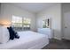 Bedroom with king bed, dresser and window at 4845 Romeo Cir, Kissimmee, FL 34746