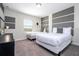 Bedroom with twin beds and gray headboard wall at 4845 Romeo Cir, Kissimmee, FL 34746