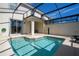 Private pool with screened enclosure and patio at 4845 Romeo Cir, Kissimmee, FL 34746