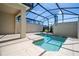 Enclosed private pool and patio with lounge chairs at 4845 Romeo Cir, Kissimmee, FL 34746